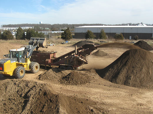 Photo of screening organic topsoil